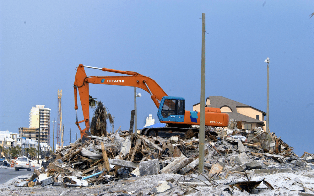 excavator clearing debris