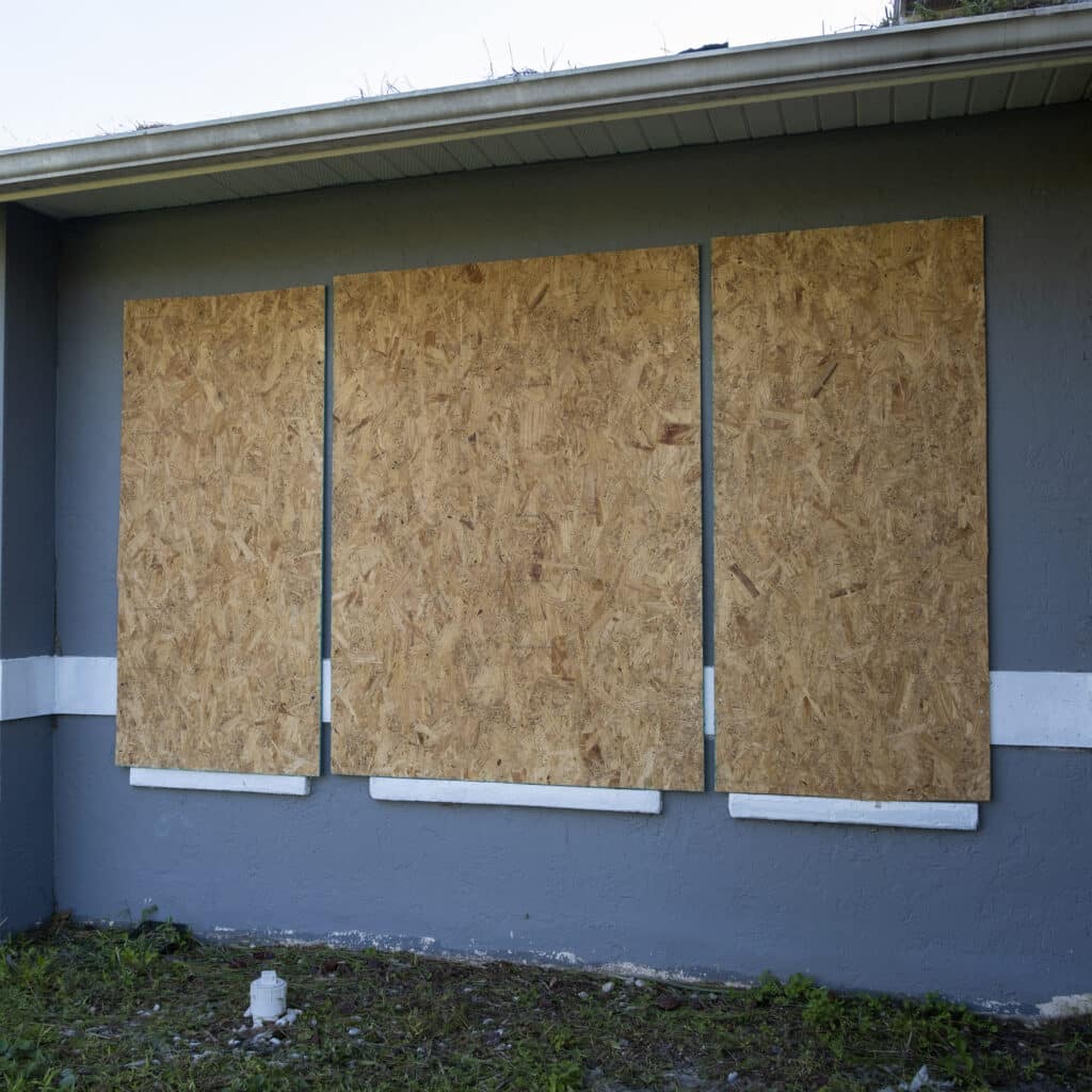http://Plywood%20storm%20shutters%20for%20hurricane%20protection%20of%20house%20windows.%20Protective%20measures%20before%20natural%20disaster%20in%20Florida.