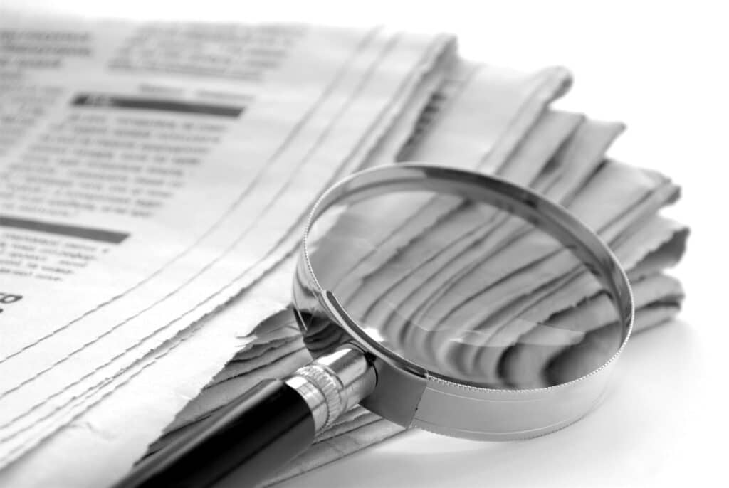 http://newspaper%20and%20a%20magnifying%20glass